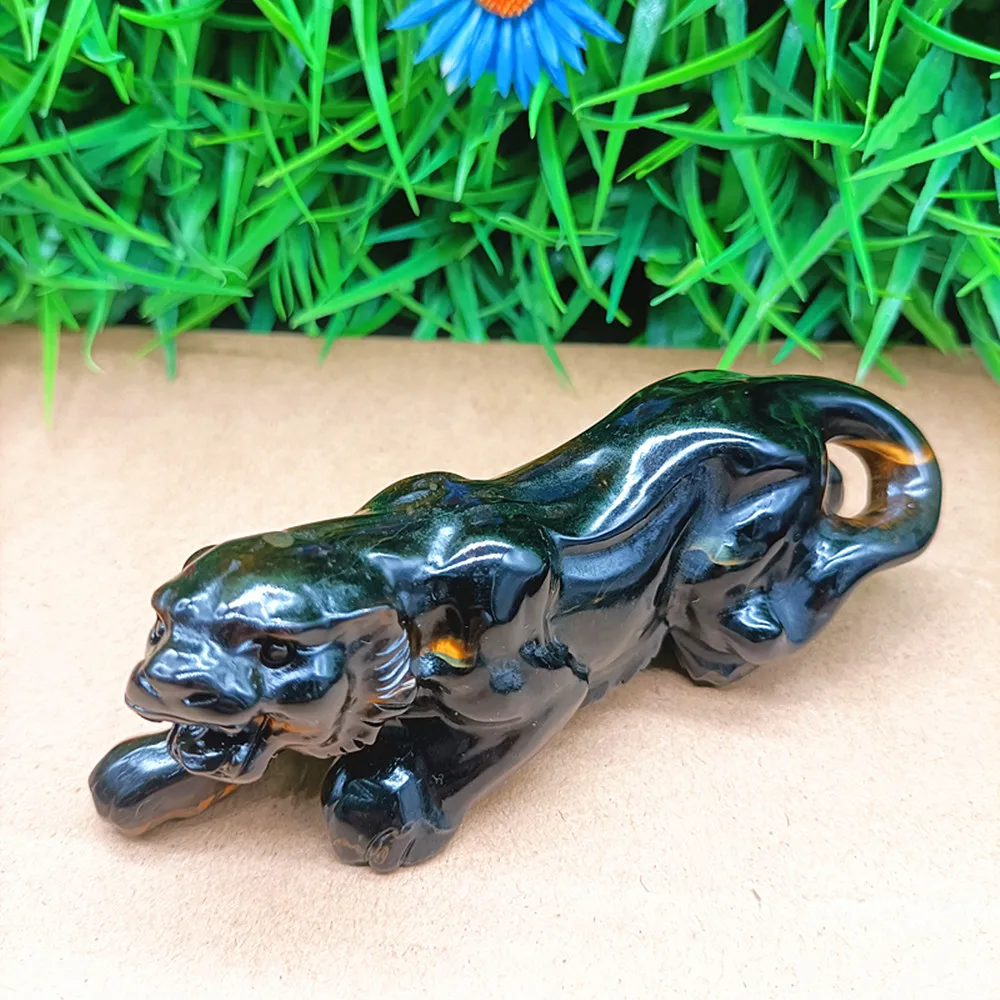 Natural quartz crystal carved into a tiger. Home decoration item. Ornament. Gift for others.
