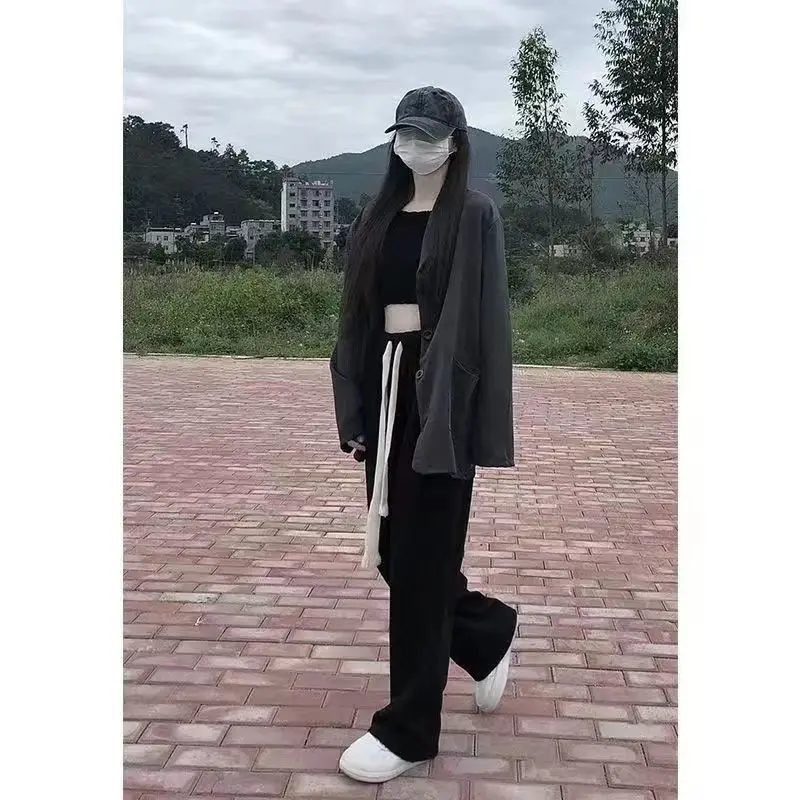 بنطال ذو قصة أرجل واسعة للنساء صيفي رفيع للغاية مثقوب مفرغ واسع الأرجل مقسم محب ناعم مطابق للتهوية قابل للتمدد 2025