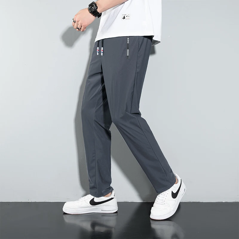 Pantalones informales de gran tamaño para hombre, M-8XL de secado rápido para deportes al aire libre, sueltos, de seda de hielo, 40kg-130kg