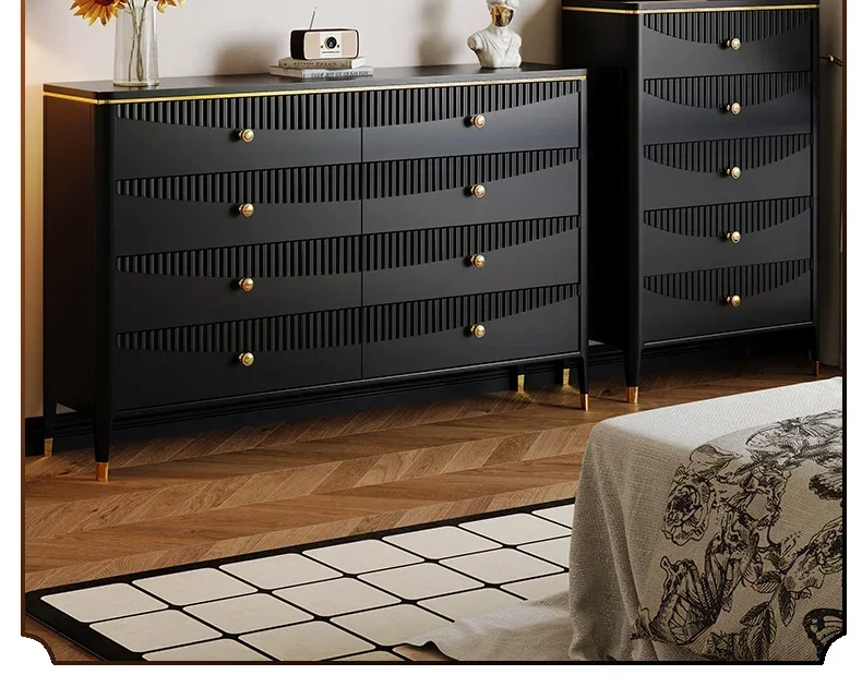 Modern living room side cabinet with black four or five drawers against the wall, storage hopper cabinet