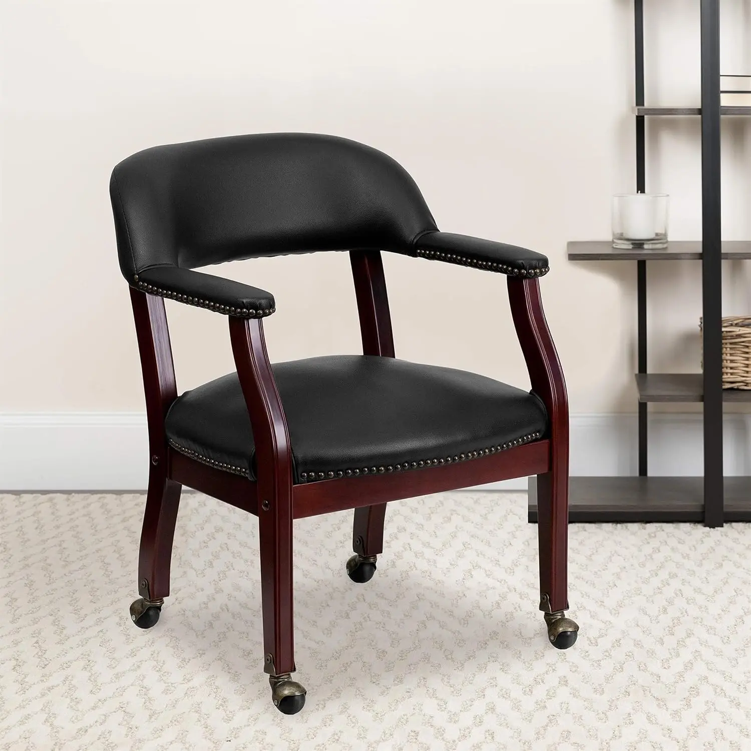 Conference Chair in Luxurious Black Vinyl with Accent Nail Trim and Casters