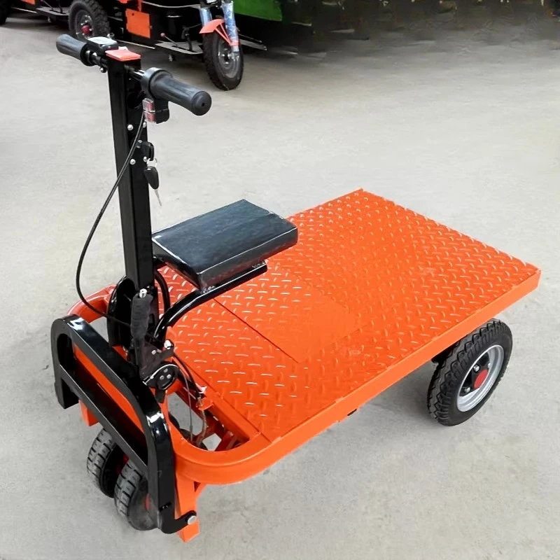 

Electric flatbed truck, truck, trolley, construction site pulling goods for decoration, entering the elevator to pull cement