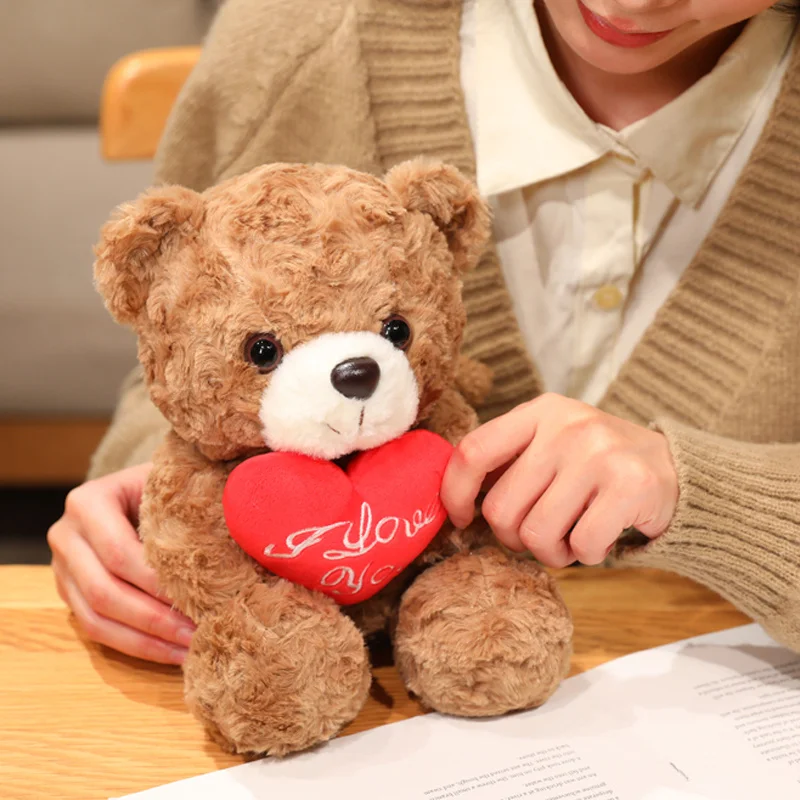 ตุ๊กตาหมีน่ารักขนาด 15/25 ซม. ขายส่ง ตุ๊กตาหมีกอดดอกไม้สีแดงโรแมนติก ตุ๊กตาหมีนุ่มน่ารัก ตกแต่งบ้าน