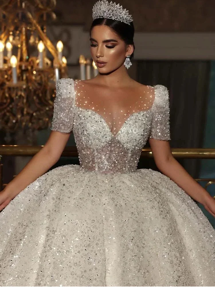 Luxo sheer o-pescoço vestido de casamento brilhante mangas curtas espartilho a linha princesa vestido de noiva novia