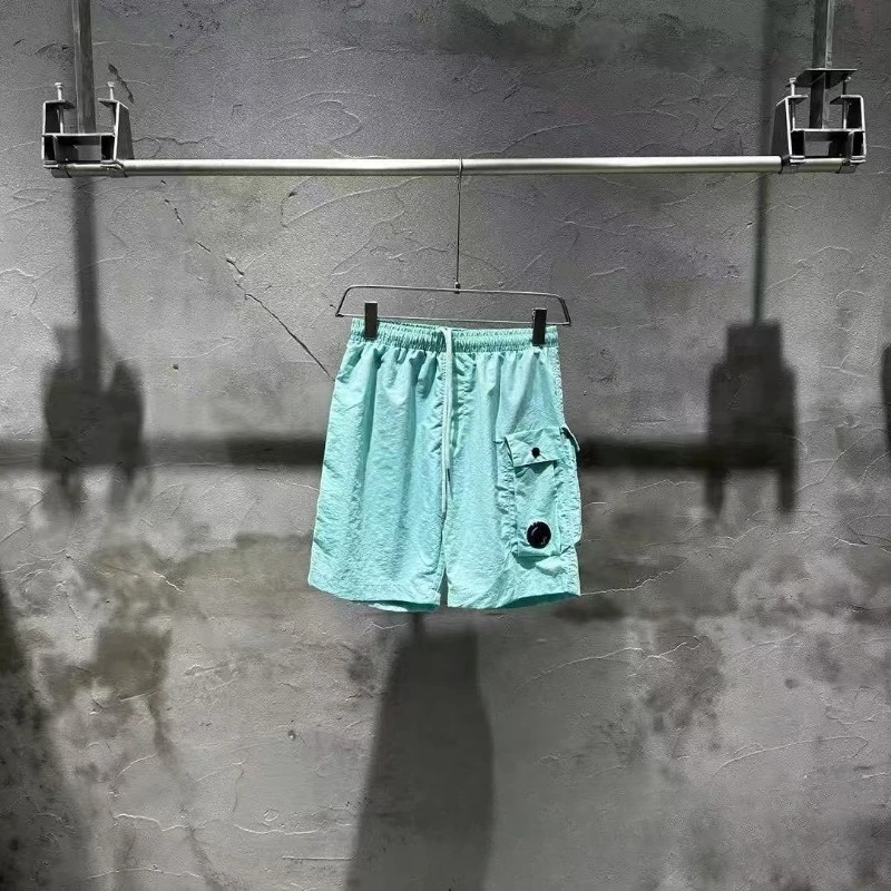 Tide Street Style Модные функциональные стильные быстросохнущие шорты Свободные повседневные повседневные шорты для пар с пятью брюками Мужские спортивные шорты