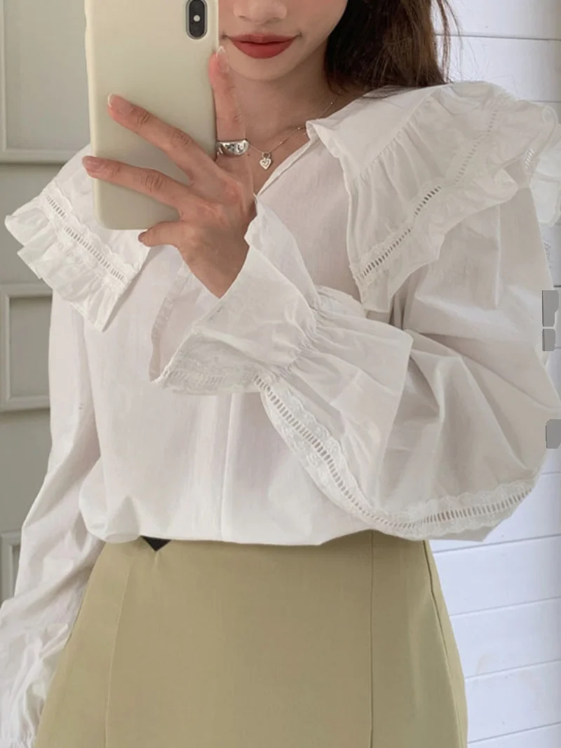 เสื้อแขนยาวทรงหลวมสไตล์เกาหลี คอระบายหวานๆ สำหรับผู้หญิง สีพื้น เหมาะกับฤดูใบไม้ผลิ ดีไซน์เก๋ไก๋ สไตล์ลำลอง แต่งผ้าต่อกัน