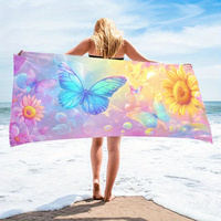 A women's oversized beach towel that is soft quick-drying and super absorbent with a beautiful butterfly and flower design