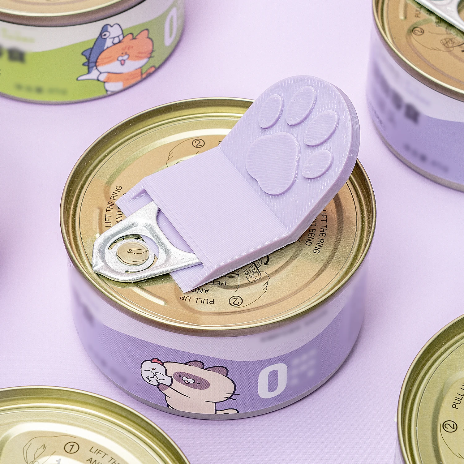 Lindo abrelatas de comida para gatos con agarre antideslizante, ergonómico y fácil de limpiar, abrelatas de plástico con forma de pata de gato para latas de comida.