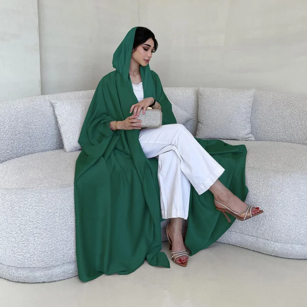 

In 2025 Middle Eastern Abaya A Muslim Modest Coat. It's A Fashionable Women's Robe Made of Soft Light Satin with Batwing Sleeves