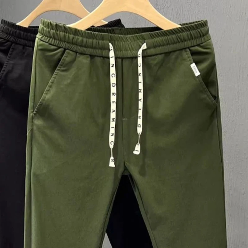 Calça masculina com harem elástica monocromática, bolsos altos, cordão com retalhos, comprimento do tornozelo que combina com tudo, moda verão