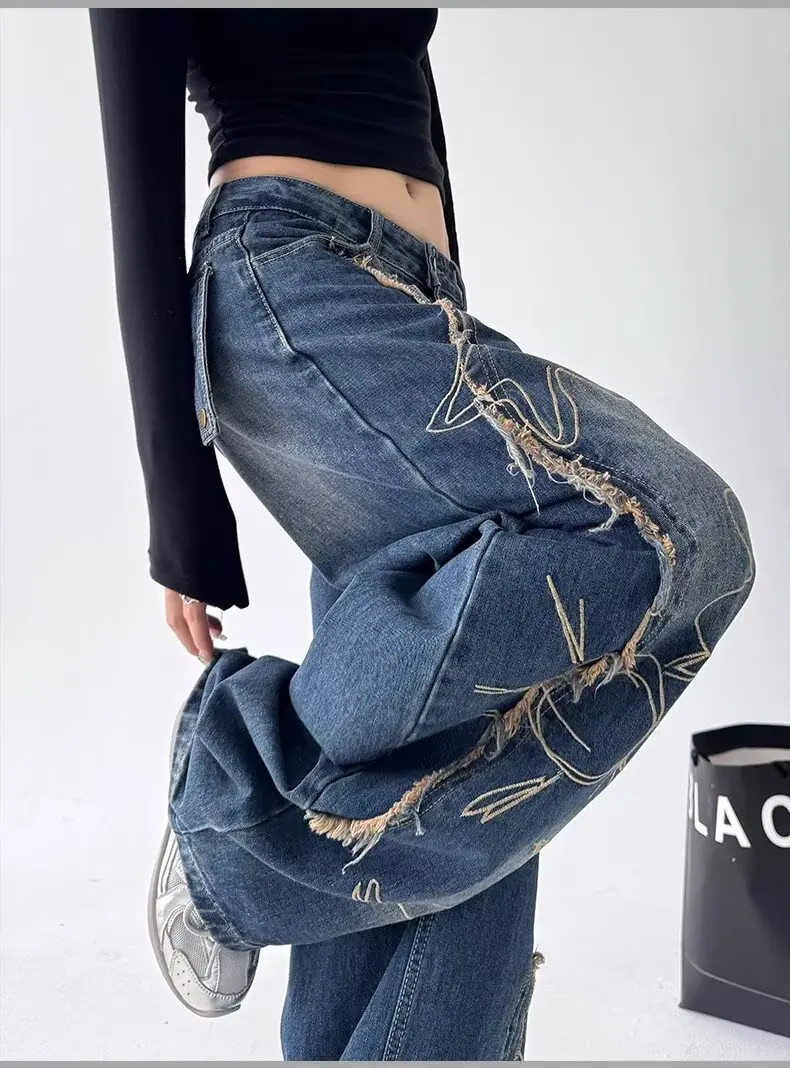 กางเกงยีนส์ทรงหลวมสไตล์อเมริกันฮิปฮอปปักลายอินเทรนด์และใช้งานได้หลากหลายสำหรับผู้หญิง กางเกงขากว้างสไตล์สตรีท Y2K สำหรับทุกเพศ