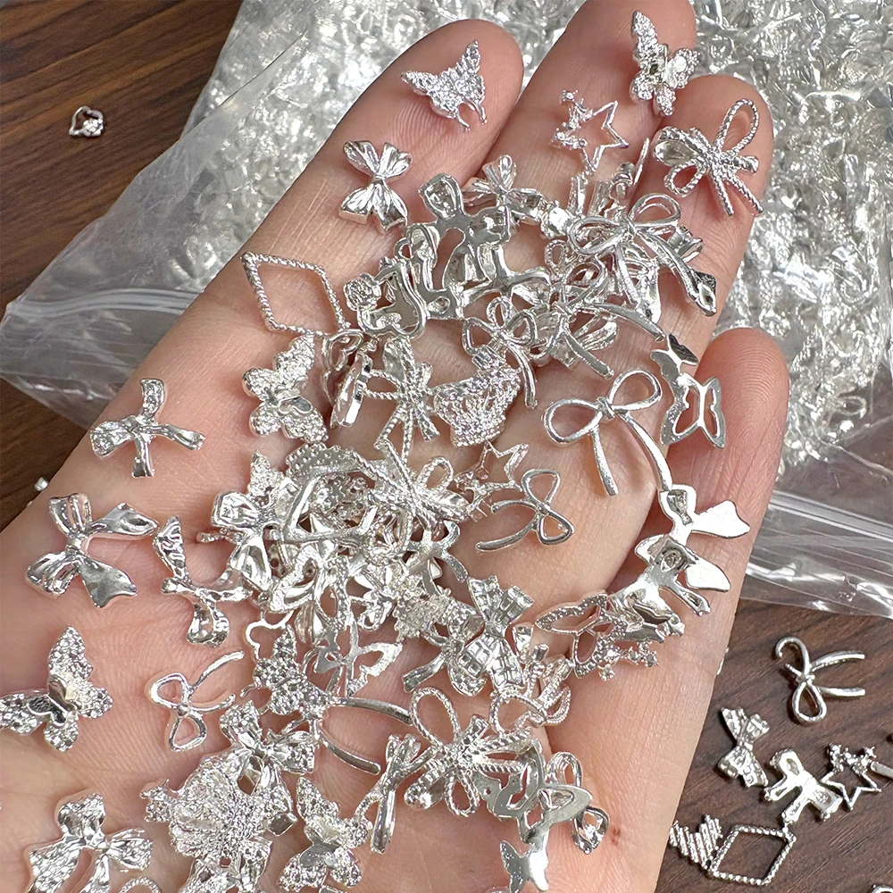 50Pcs 3D Silver Metal Bow Star Butterfly Nail Charms Mixed Random Shiny Heart Love Bowknot Nail Jewelry DIY Luxury Manicure Deco