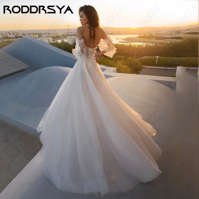 فساتين زفاف بأكمام طويلة من RODDRSYA Vestido De Noiva نفخة للنساء على شكل قلب a-line حفلة زفاف رومانسية بأربطة بدون ظهرVestido De Noiva نفخة للنساء على شكل قلب a-line حفلة زفاف رومانسية بأربطة بدون ظهرVestido De Noiva