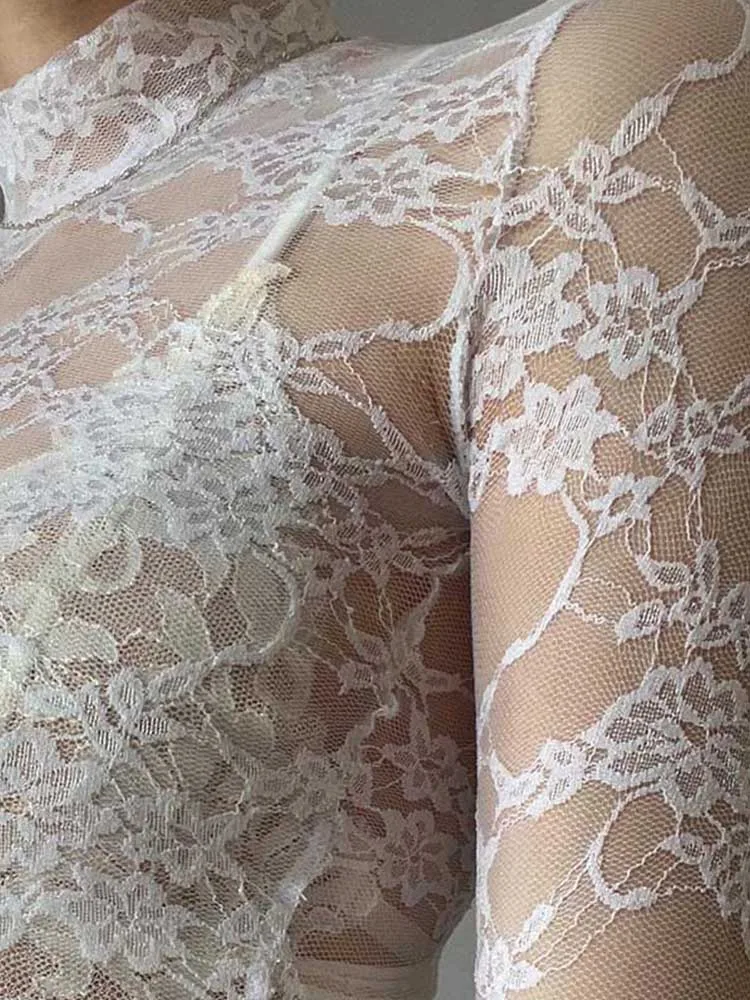 

Elegant white lace long sleeved crop top Y2K and Korean fashion aesthetics.
