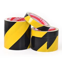 Black and yellow safety tape warning and danger tape, used to mark walls, floors, pipes, and equipment