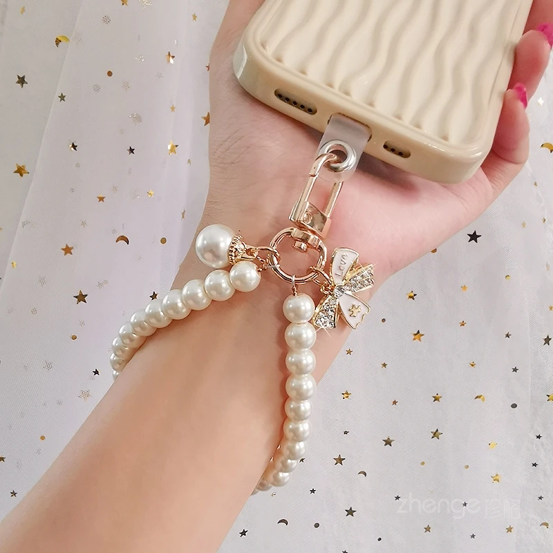 Mobile Phone Lanyard Wrist Rope Inlaid with Rhinestone Bow Pearl Bracelet Hand String Pearl Mobile Phone Lanyard Chain Hand