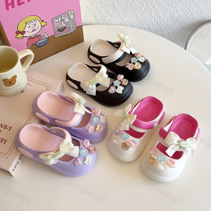 

Детская модная повседневная обувь в форме пещеры, лето 2021, полые дышащие сандалии принцессы с рисунком банта для девочек, удобные тапочки
