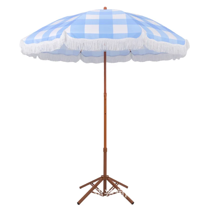 

Seaside vacation beach umbrella courtyard lattice fringed sun swimming pool sun terrace parasol