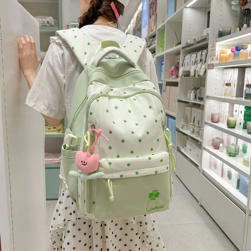 2026New style girly four-leaf clover backpack for women, college style, large capacity, lightweight school bag, high aesthetic v