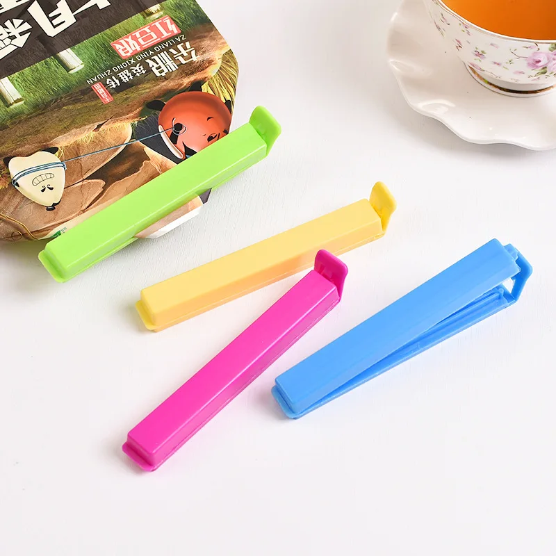 

Уплотнительные зажимы Красочные пластиковые зажимы для кухонных аксессуаров Многоразовые влагостойкие зажимы для хранения свежих закусок Уплотнитель цветных пакетов