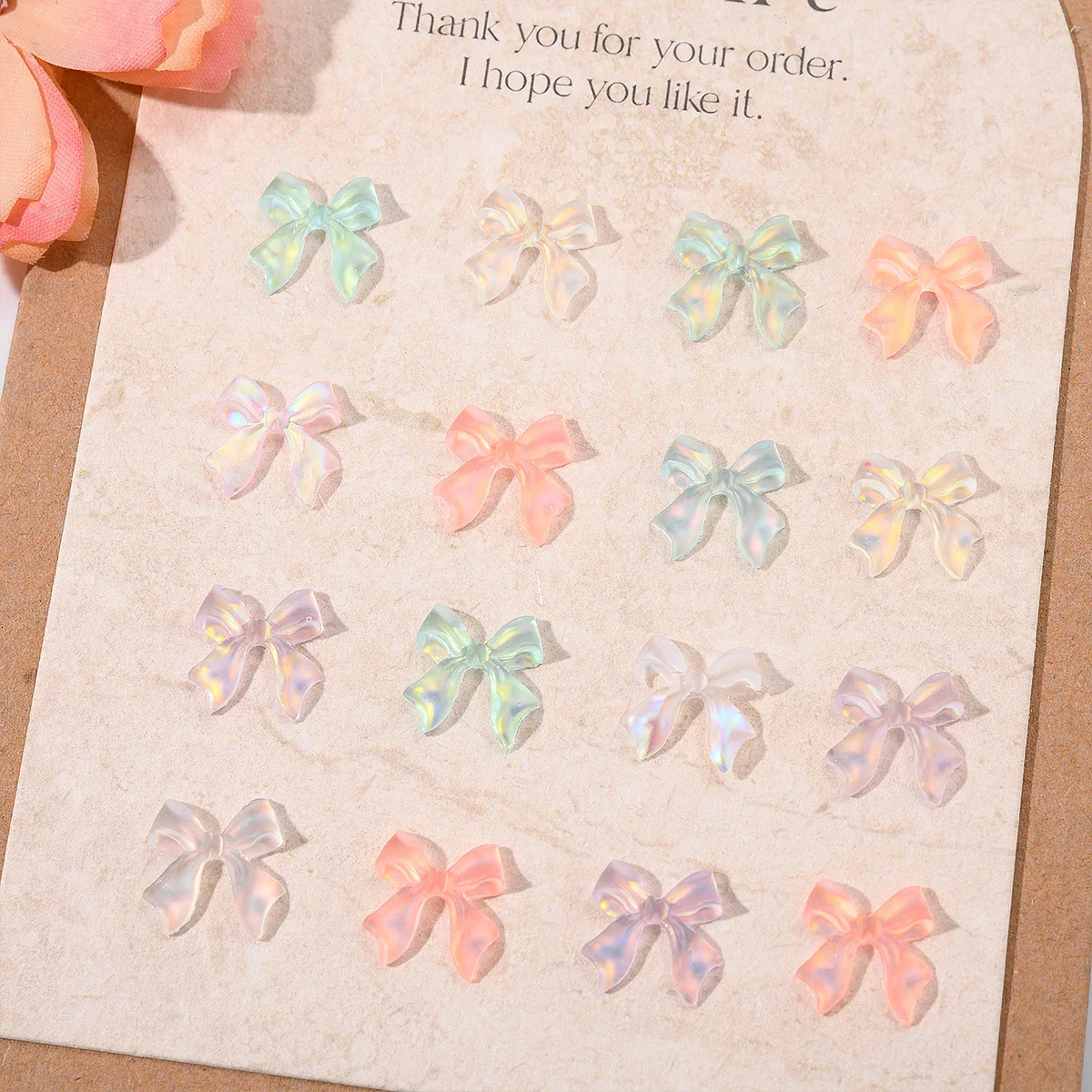 ชาร์มตกแต่งเล็บริบบิ้นออโรร่ามอคค่า 50 ชิ้น คละสี อุปกรณ์ตกแต่งเล็บ 3 มิติ เรซิ่น ประดับเล็บ อุปกรณ์ทำเล็บ