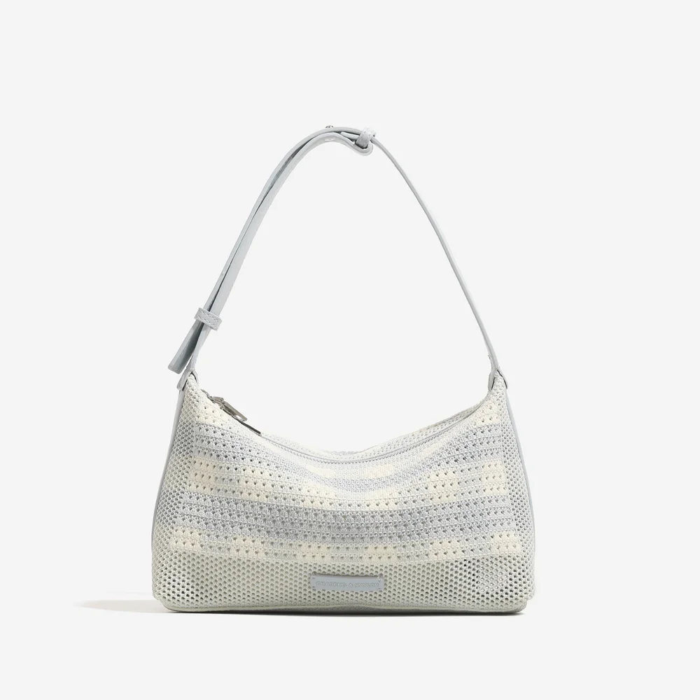 Uniquely designed woven armpit bag for women in the summer of 2026, featuring a lightweight vacation style and a single shoulder