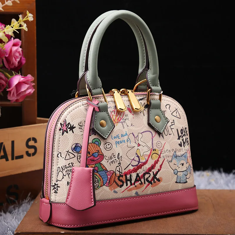 

Luxury and Special Handheld Shell Bag with Delicate Cartoon Graffiti and High Quality Leather Women Newly Trendy Crossbody Bag