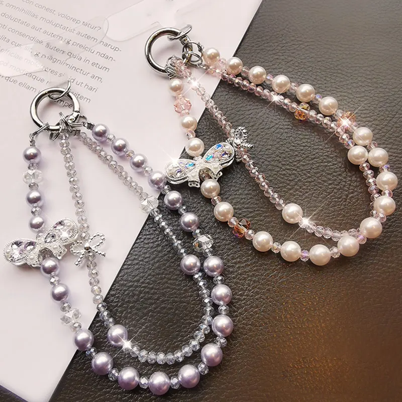 Bracciale da polso con cordino per telefono in cristallo scintillante con catena per telefono con fiocco di lusso e perla per accessori per custodie per telefoni