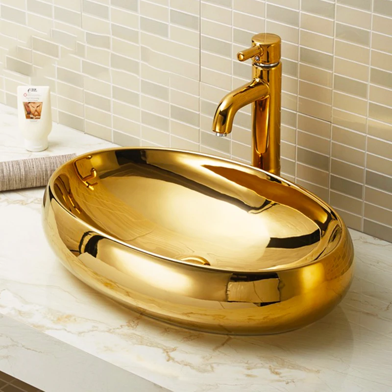 

New oval ceramic gold-plated washbasin with gold-plated washbasin on washbasin