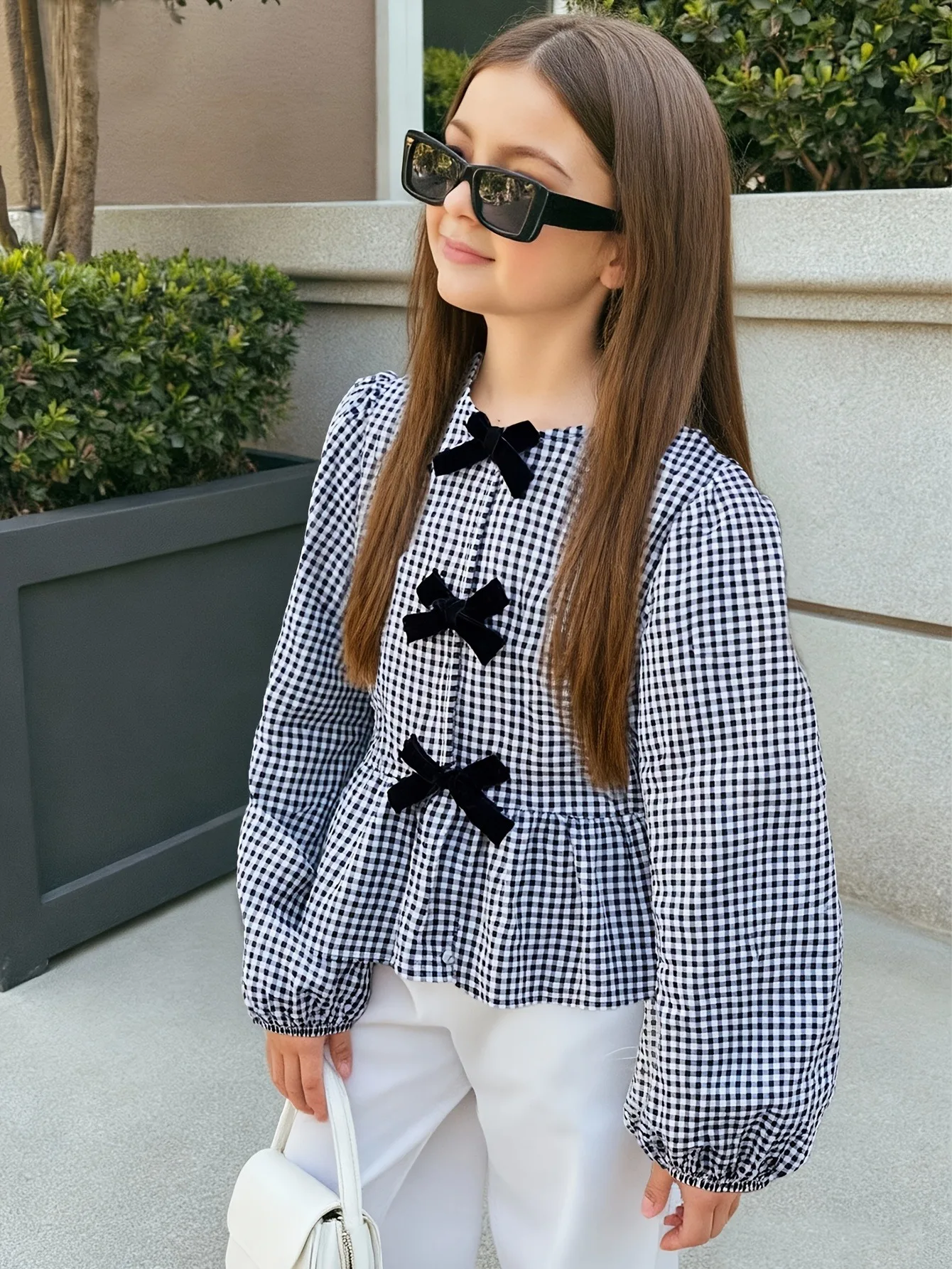 This Children's Plaid Ruffled Top Features Three Bow Decorations, Puffy Sleeves, a Round Neck, and Is Suitable for School or Any Occasion