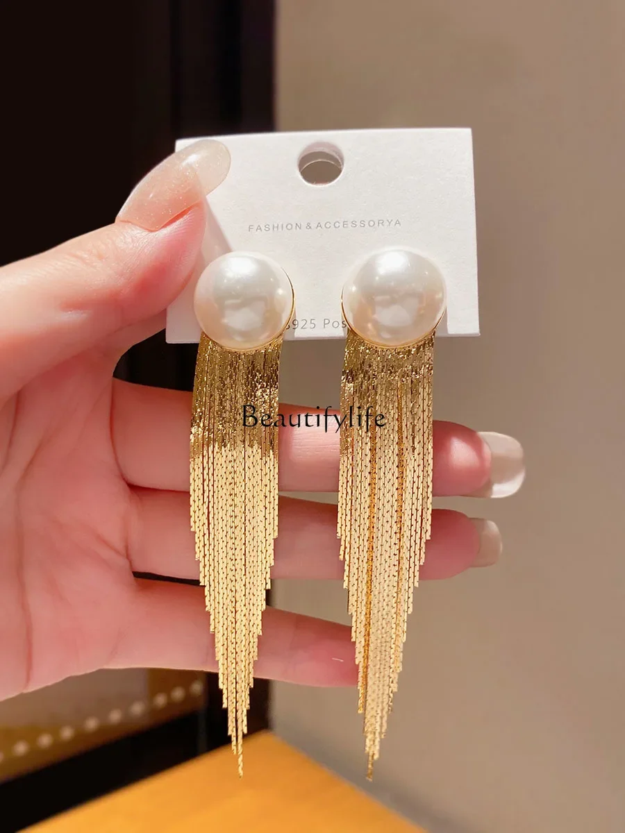 

Exaggerated high-end long fringed big earrings women's niche temperament pearl earrings look thin