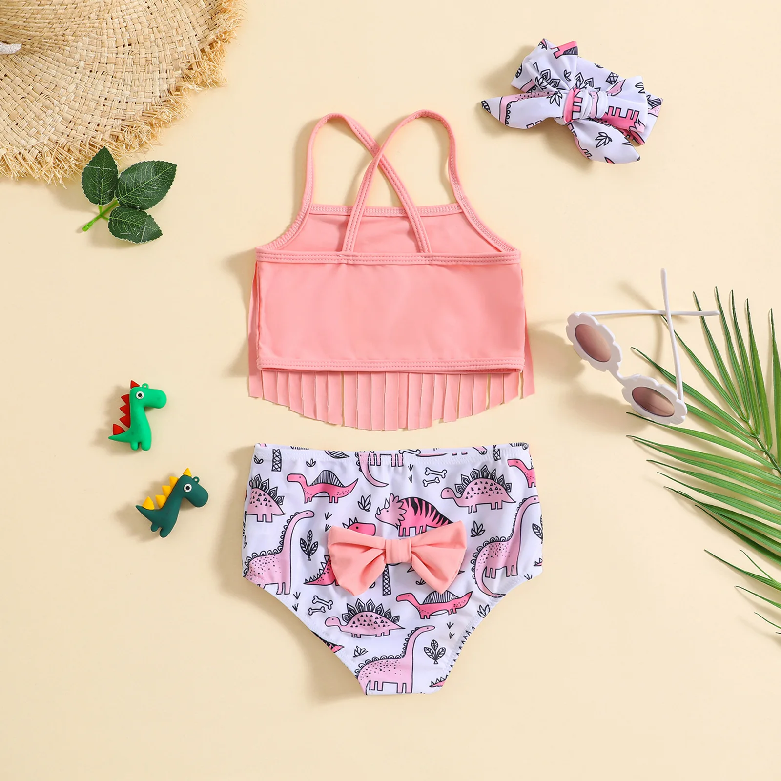 Baby two piece swimsuit printed with dinosaur pattern suitable for seaside trips and pool water play