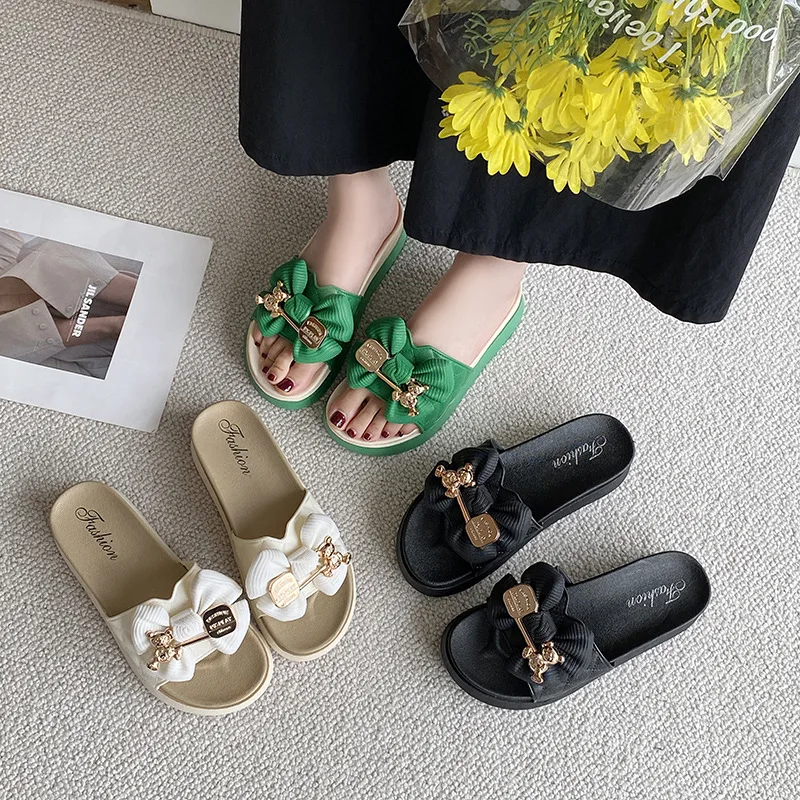 Slippers wearing cute bow drag fashion flat sandals and slippers.Personalized deodorization