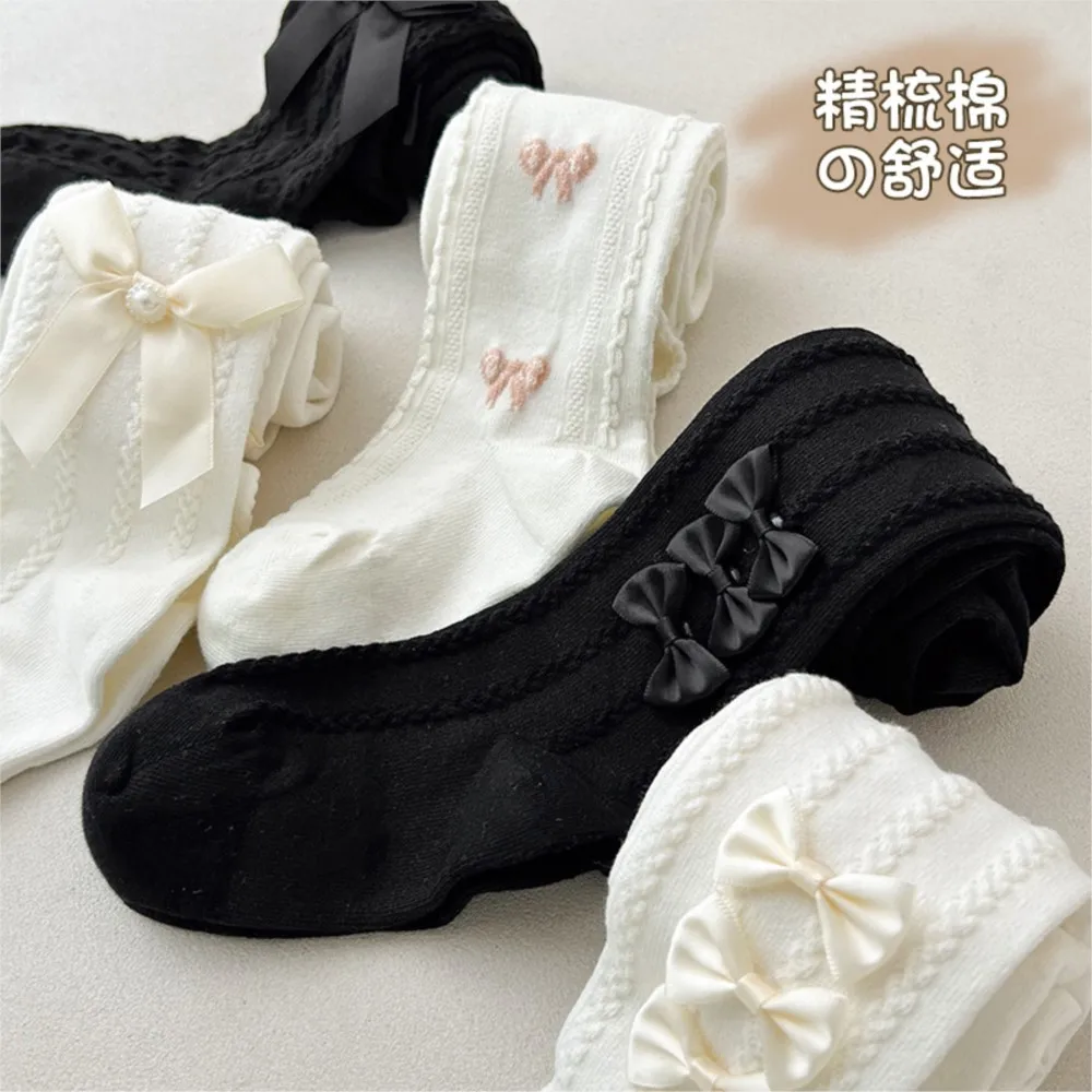 Spring and autumn new side bow children's pantyhose girls wearing leggings three butterfly baby socks for children.