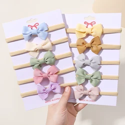 Mini bandeaux élastiques en nylon pour filles, nœuds de ruban mignons, vêtements de sauna doux pour nouveau-nés, accessoires pour cheveux de bébé, vente en gros, ensemble de 5 pièces