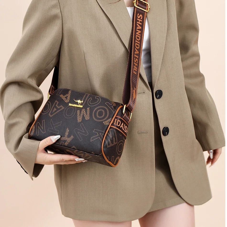 Luxury Kangaroo Logo Crossbody Bag with Printed Design Wide Strap Stylish Magnetic Snap Pockets Premium Gold Hardware