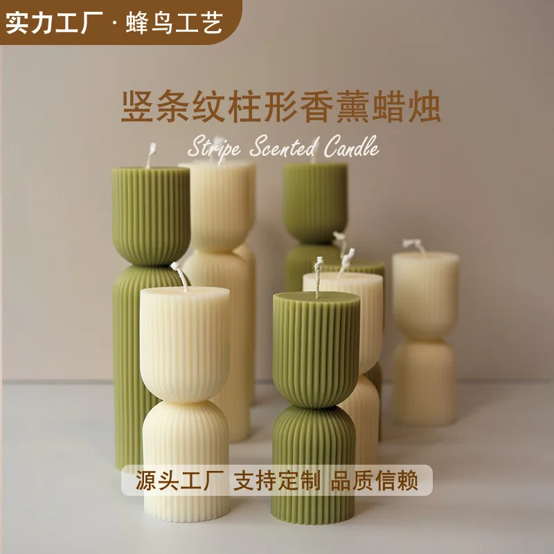 Handmade scented candles with striped columns. White and green decoration. Blue wind chimes scented candles accompanied the cere