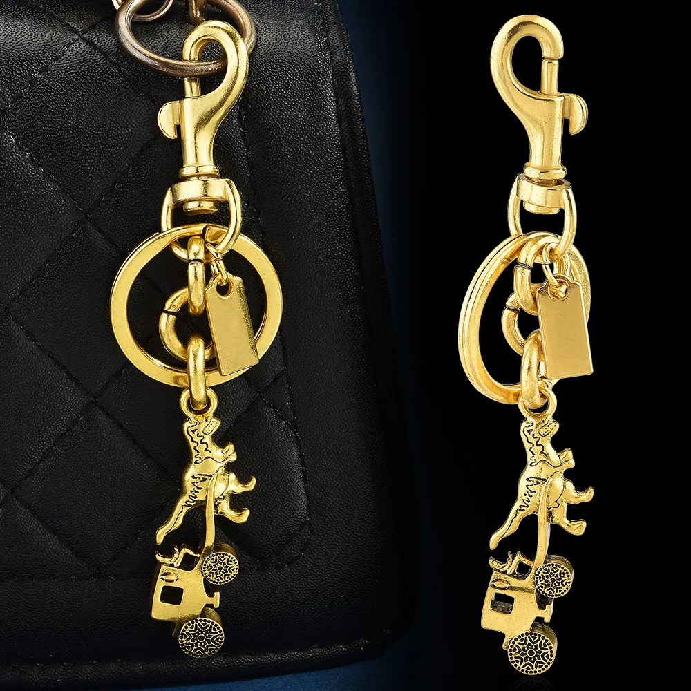 

New alloy creative carriage bag pendant, female dinosaur pulling a carriage keychain pendant