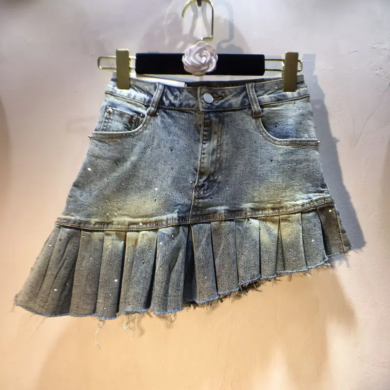 

Europe Station 2026 Spring New Heavy Rhinestone High Waist Slimming Slanted Hem Elastic Denim Skirt, Short Skirt for Ladies