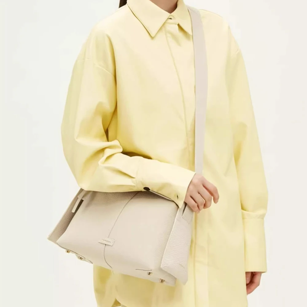 Songmont hanging ear series eaves bag designer new head layer cowhide commuter handheld crossbody hobo bag