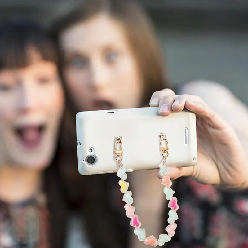 สายรัดข้อมือโทรศัพท์มือถืออะคริลิคลูกปัดเชือกโทรศัพท์สไตล์กลางแจ้งเกียร์สร้างสรรค์กระเป๋าเป้สะพายหลังเครื่องประดับสําหรับช้อปปิ้งขี่จักรยาน Taking