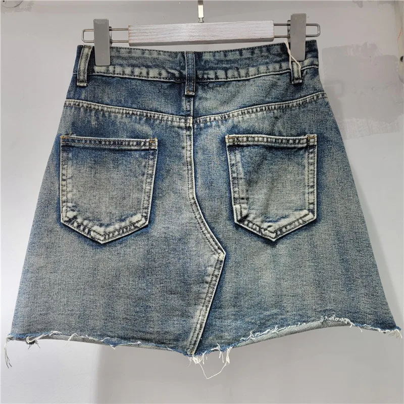 

Edgy patchwork denim skirt. This A-line bodycon cut is crafted with detailed stitching for an edgy-meets-elegant vibe.