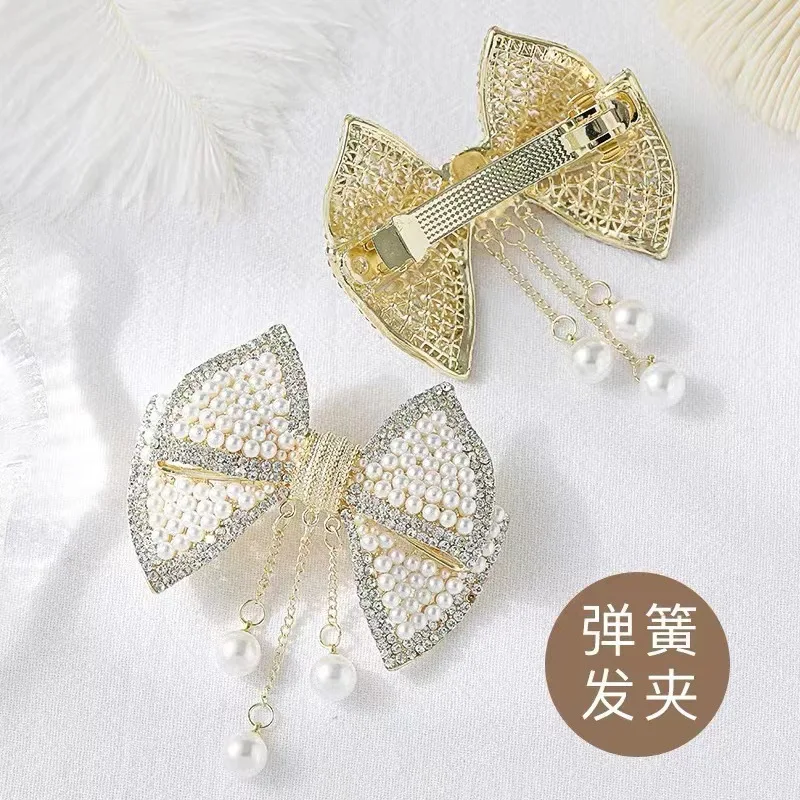New bow hair clip for women, imitation pearl and rhinestone spring clip, light luxury high-end style hair accessory view 3