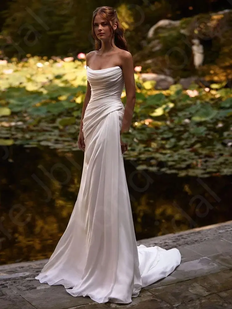 فساتين زفاف جديدة ساحرة مخصصة باللون الأبيض 2025 زي العرائس فساتين العروس الصيفية حورية البحر بدون حمالات فساتين زفاف شاطئ بوهو