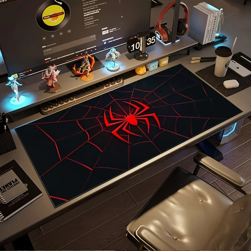 A Large Gaming Mouse Pad Featuring a Red And Black Spider Web Design with a Spider Hero Logo. It Is Non-Slip, Durable