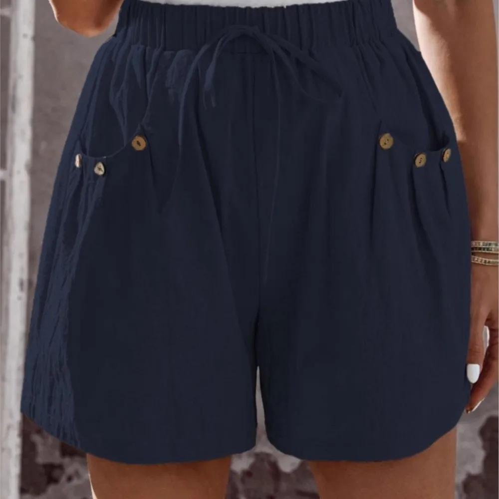 2025 novo estilo de verão feminino casual solto shorts bolso viajando all-match estilo simples quente na moda botão cor sólida moda