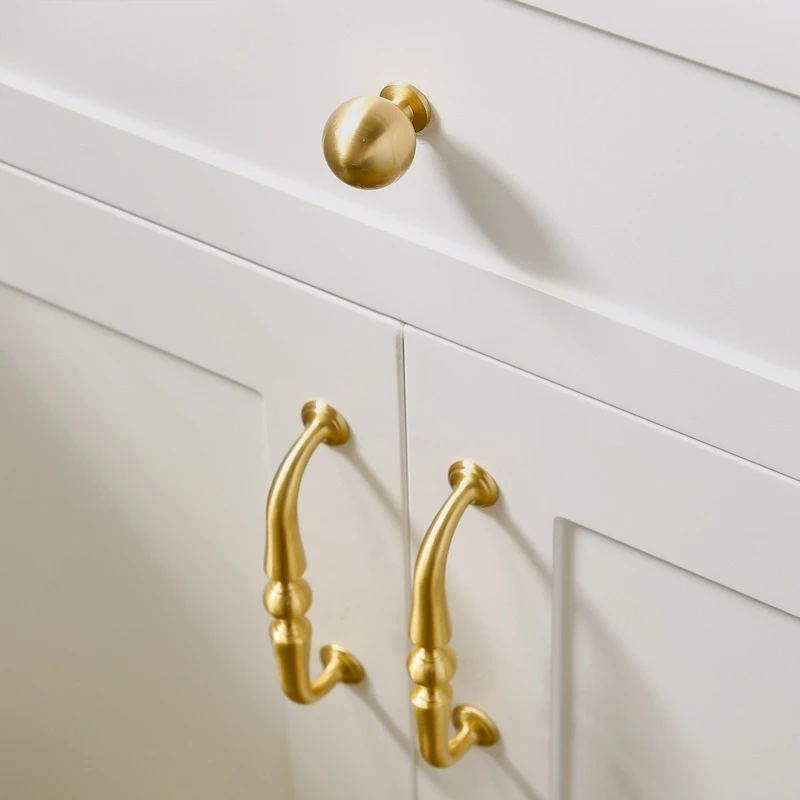 Bronze American-style kitchen cabinet luxury door handles with Nordic modern minimalist design featuring golden round pulls