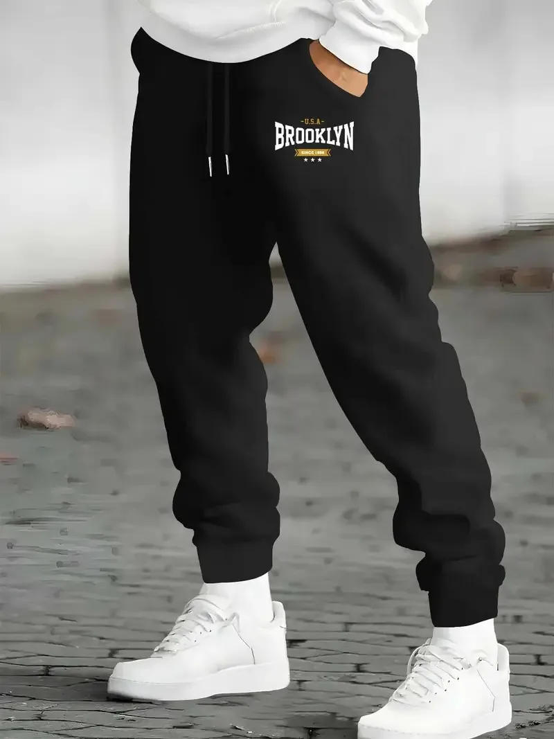 

The new men's trousers for Spring and Autumn 2025 are casual fashionable comfortable and soft with 3D letter prints