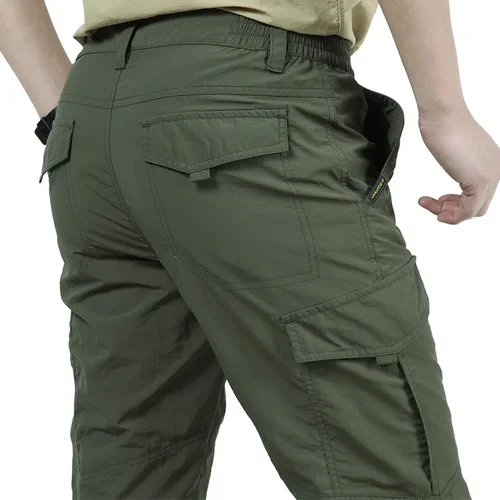 Imagen 1 del producto Pantalones tácticos para hombre al aire libre, pantalones tácticos con múltiples bolsillos elásticos para ir al trabajo urbano, pantalones Cargo ajustados y gordos para hombre 5XL, novedad de 2025 