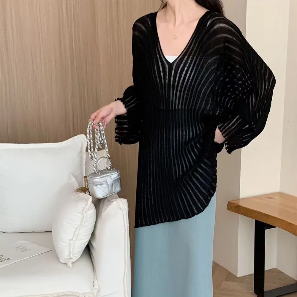 

Autumn 2024 new women's casual fashion Joker slim commuter high elastic irregular V-neck hollow knit blouse.